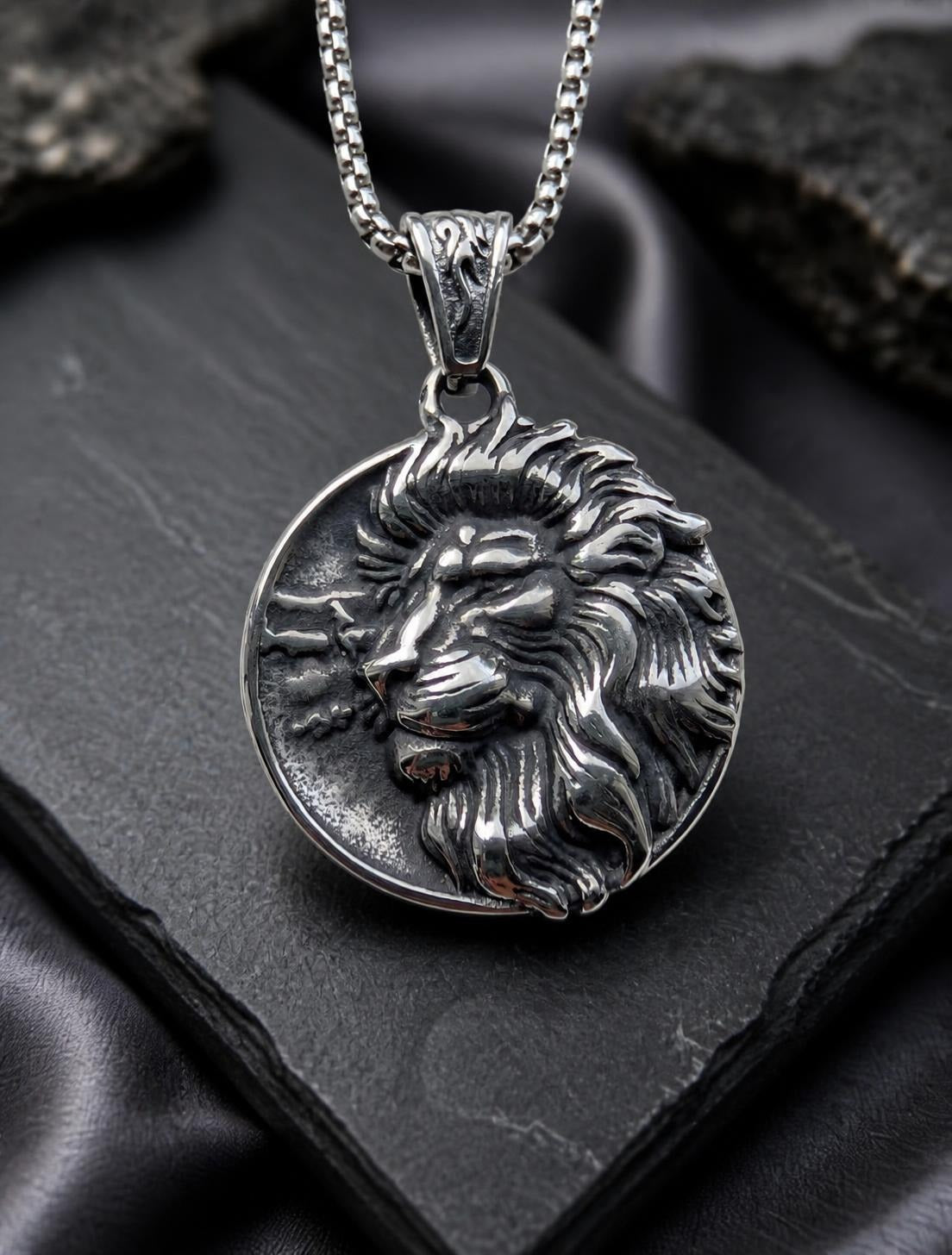 Close up of the Lion of Sparta silver necklace featuring a detailed lion head medallion pendant.
