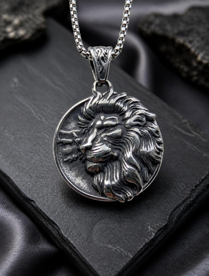 Close up of the Lion of Sparta silver necklace featuring a detailed lion head medallion pendant.