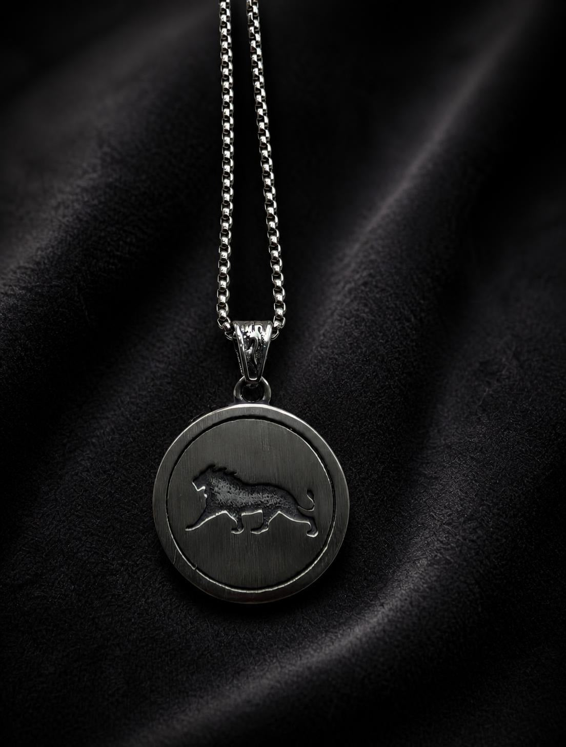 Silver Lion of Sparta necklace with round lion medallion pendant displayed on a black background.