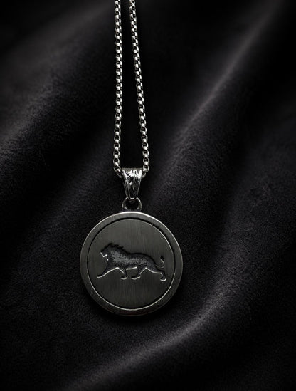 Silver Lion of Sparta necklace with round lion medallion pendant displayed on a black background.