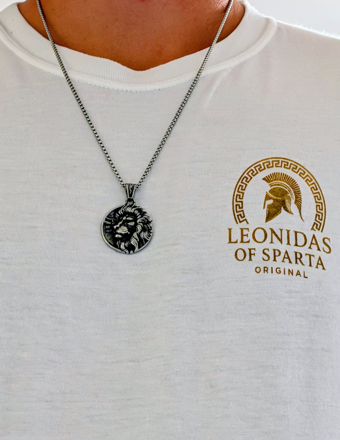 Lion of Sparta silver pendant necklace worn with a Leonidas of Sparta Original white t-shirt.