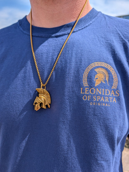 Gold Spartan Legacy Necklace worn with a blue Leonidas of Sparta T-shirt